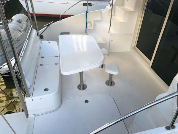 Leopard-37 PC 2008-Even Keel Cocoa Beach-Florida-United States-Aft Deck Table With Bar Stools And Built In Seating And Storage-1546927