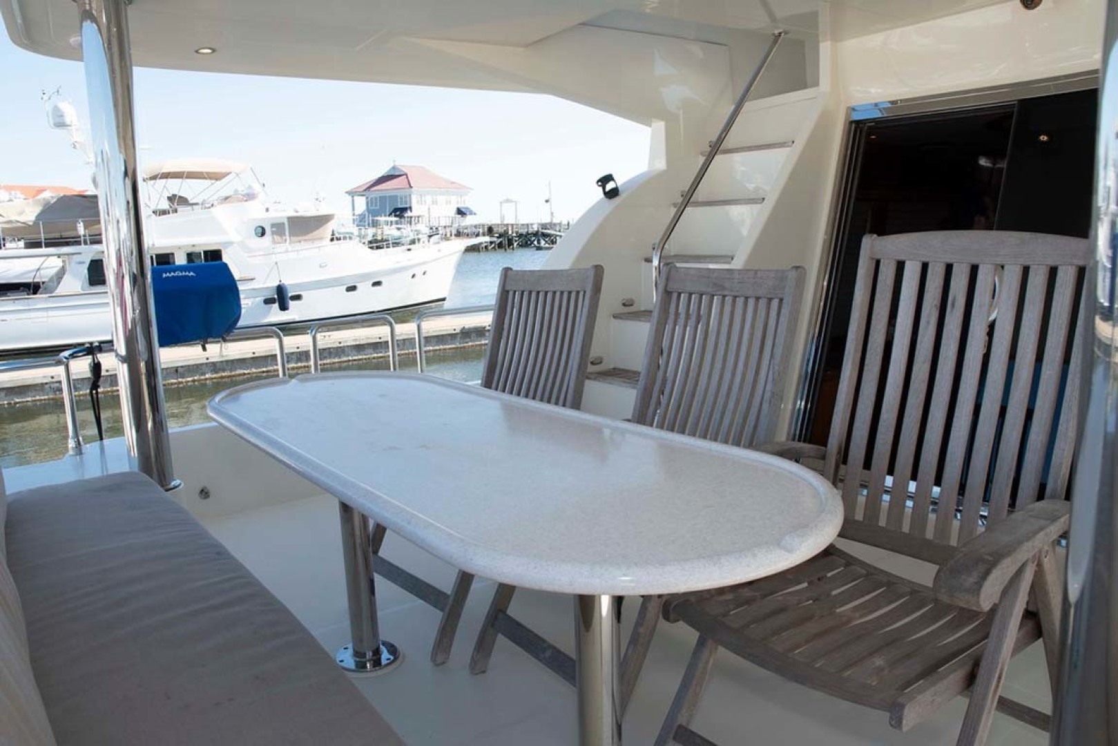 Hampton-60 Motor Yacht 2007-Family Biz Mount Pleasant-North Carolina-United States-Aft Deck  Teak Chairs & Corian Table Top-1600120 | Thumbnail