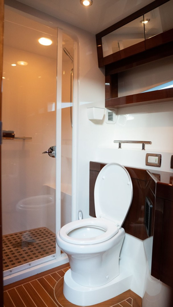 Savannah-54 2011-INVERSE ENTROPY Fort Lauderdale-Florida-United States-Circular shower stall with teak grate, sliding plexiglass door panels, exhaust fan, rainforest shower head and hand-held-1868636