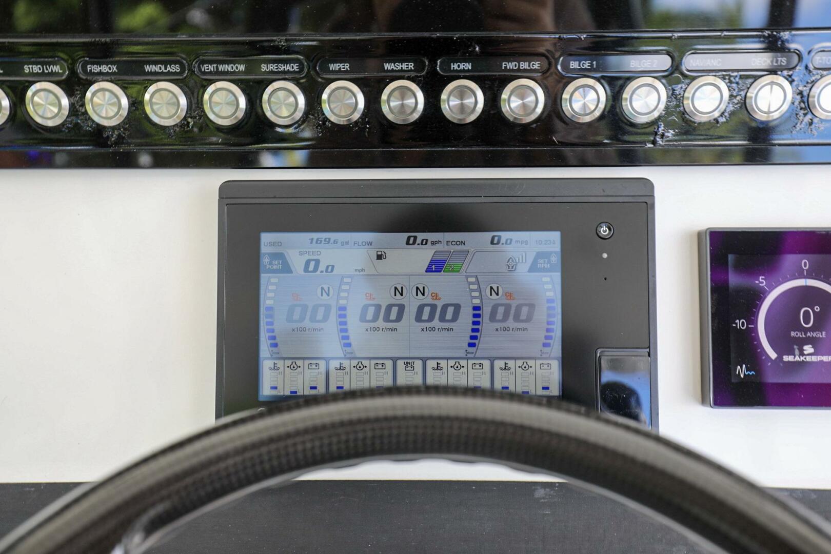 Regulator-41 2020-Grey Hull Stuart-Control panel of a 2020 Regulator 41 boat with digital display and buttons.-4946329 | Thumbnail