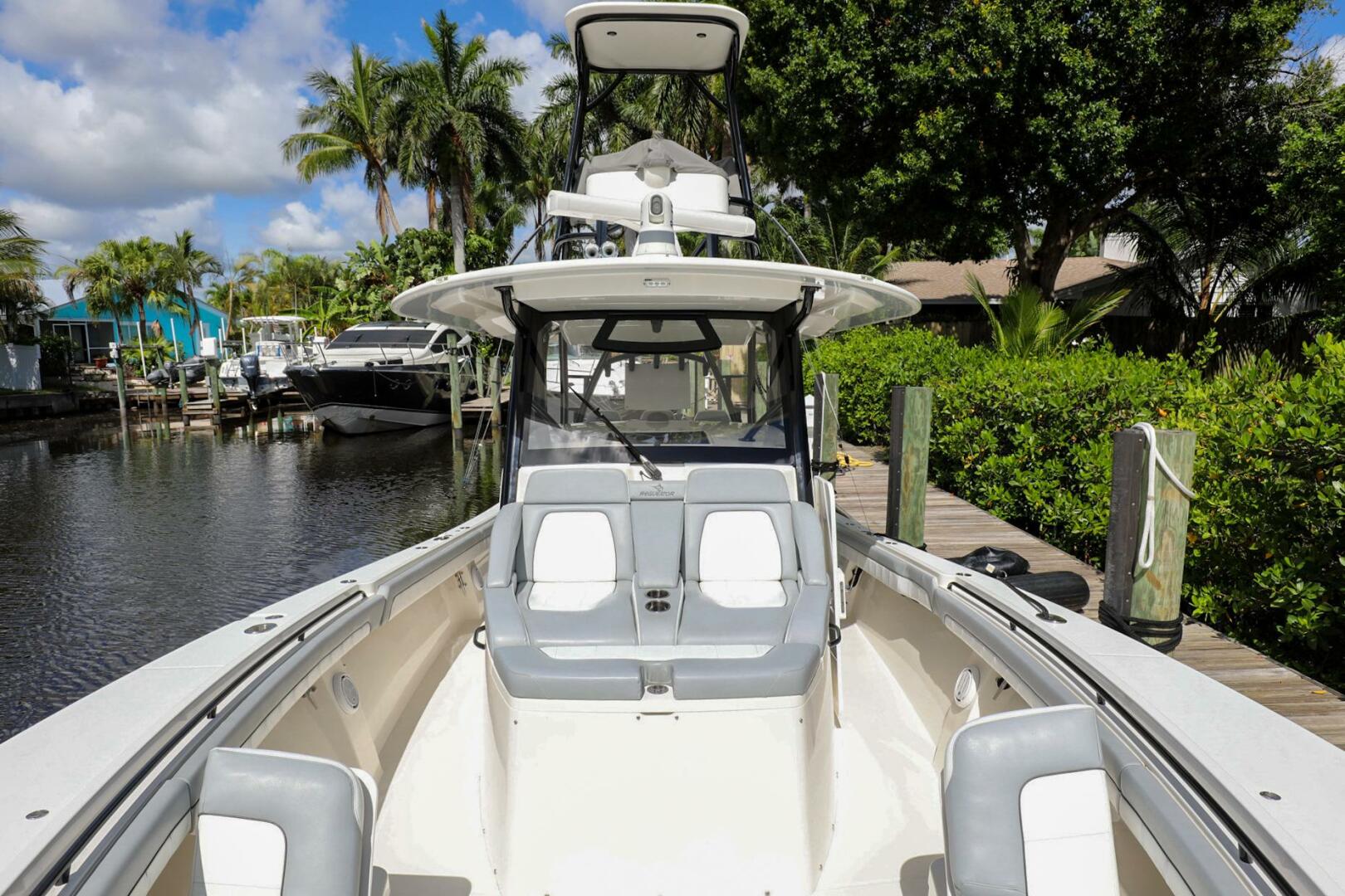 Regulator-41 2020-Grey Hull Stuart-2020 Regulator 41 boat docked in a scenic marina with lush greenery.-4946345 | Thumbnail