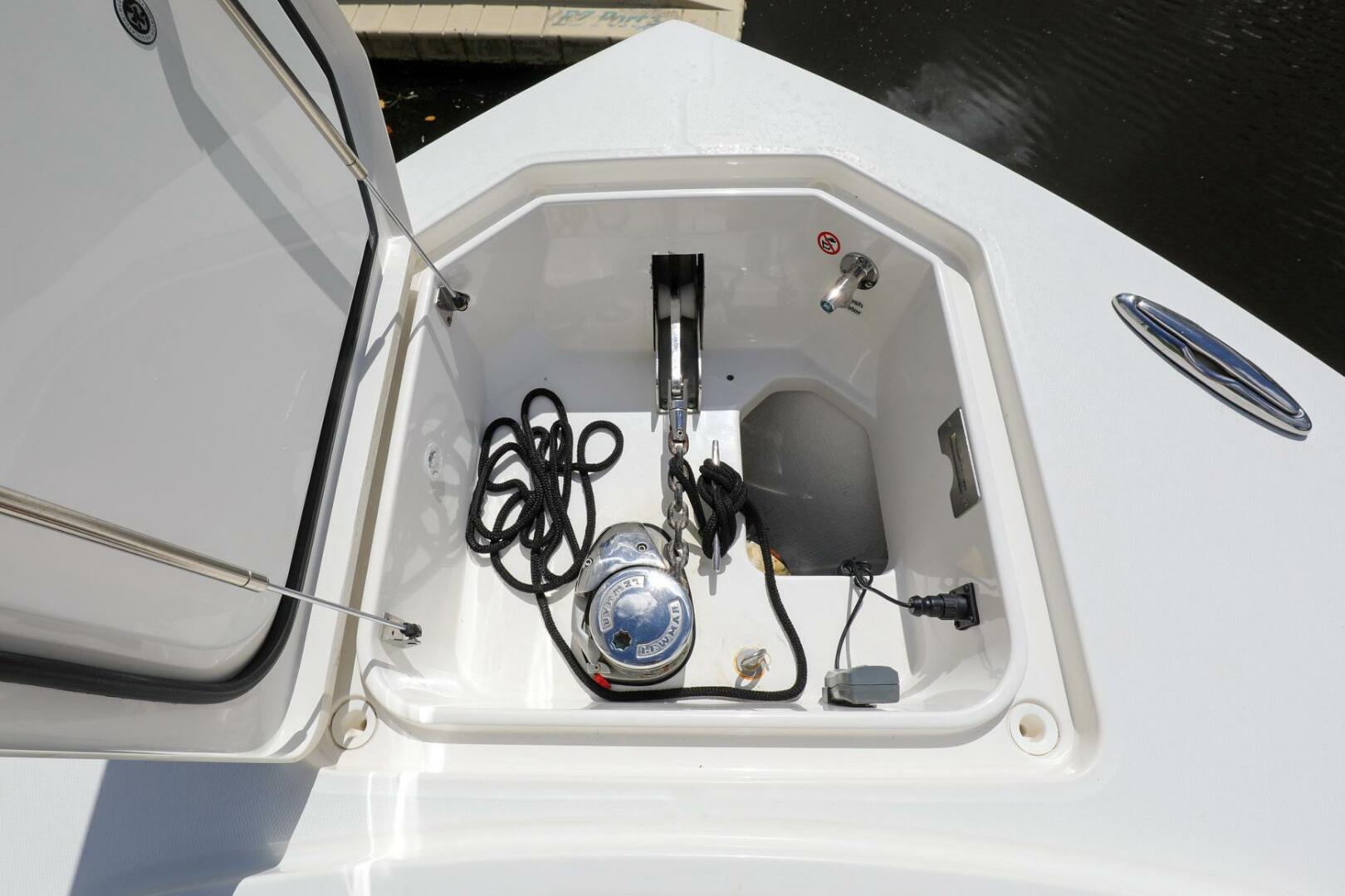 Regulator-41 2020-Grey Hull Stuart-Open storage compartment on a 2020 Regulator 41 boat with anchor and ropes.-4946344 | Thumbnail