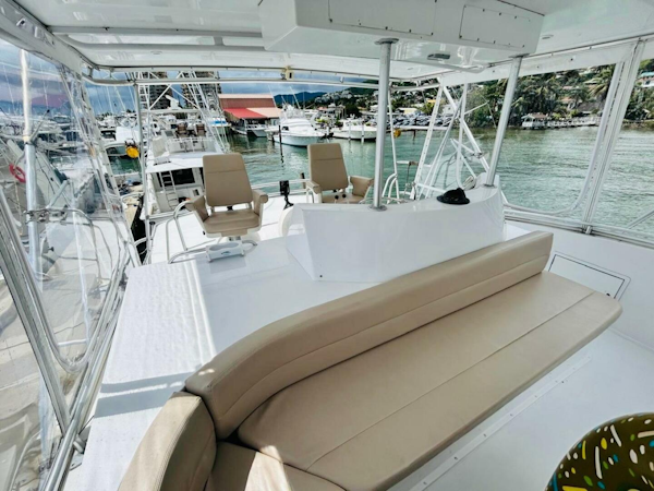 Bertram-54 1988 -Stuart-1988 Bertram 54 yacht interior with seating, docked at marina.-4947247
