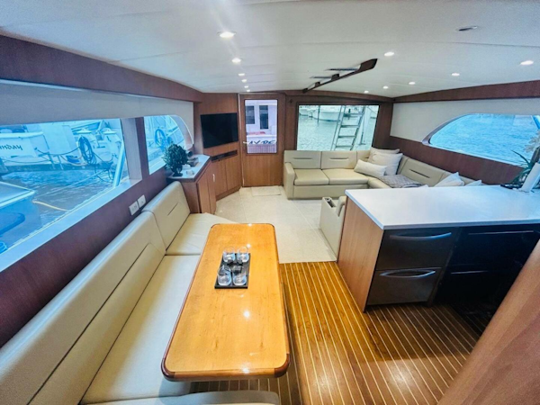 Bertram-54 1988 -Stuart-Luxurious interior of a 1988 Bertram 54 yacht with elegant seating and wood finishes.-4947219