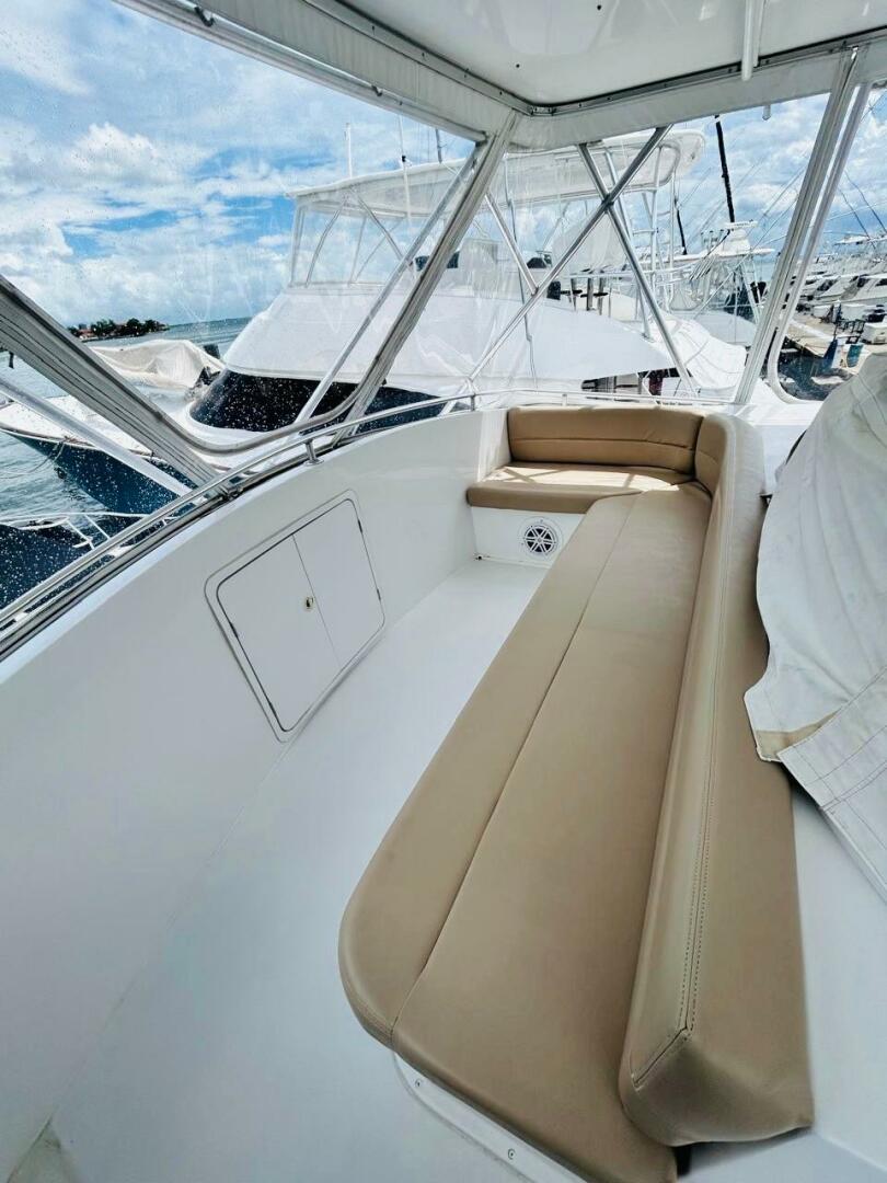 Bertram-54 1988 -Stuart-1988 Bertram 54 yacht interior with beige seating and marina view.-4947240 | Thumbnail