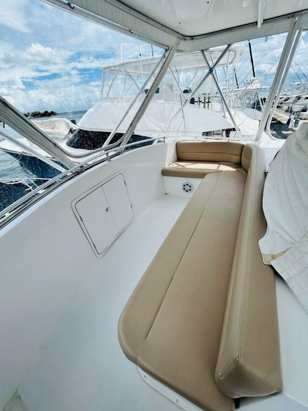 Bertram-54 1988 -Stuart-1988 Bertram 54 yacht interior with beige seating and marina view.-4947240