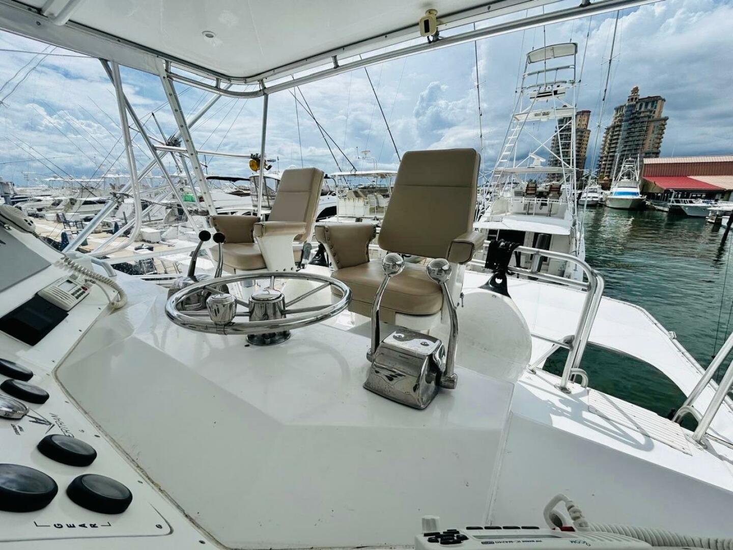 Bertram-54 1988 -Stuart-1988 Bertram 54 yacht helm with dual captain chairs at marina.-4947248 | Thumbnail