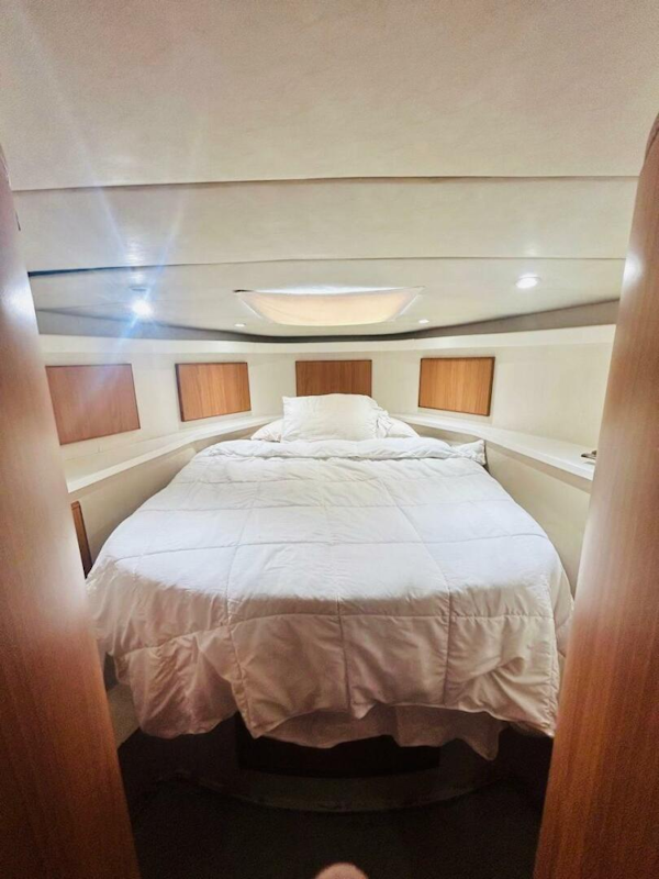Bertram-54 1988 -Stuart-Luxurious bedroom interior of 1988 Bertram 54 yacht with cozy bedding.-4947227