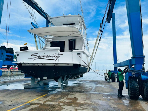 Bertram-54 1988 -Stuart-1988 Bertram 54 yacht Sea-renity being lifted at a marina.-4947200