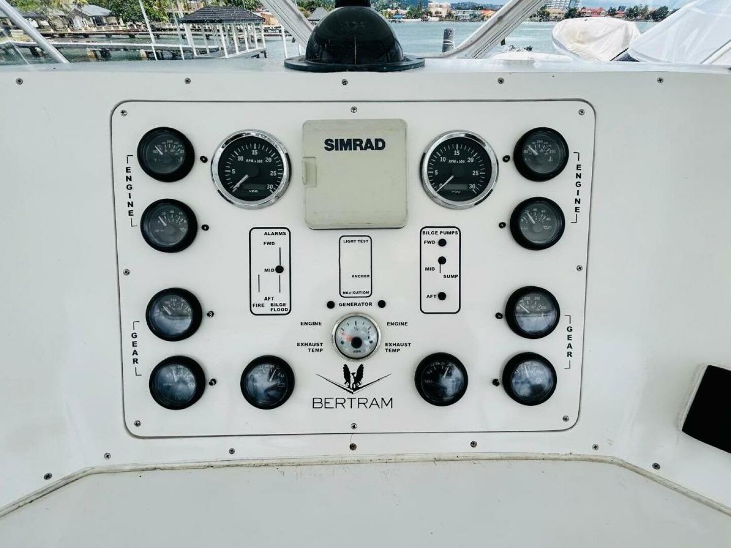 Bertram-54 1988 -Stuart-Control panel of a 1988 Bertram 54 yacht with gauges and Simrad equipment.-4947244 | Thumbnail