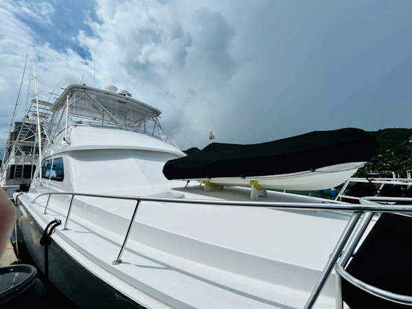 Bertram-54 1988 -Stuart-1988 Bertram 54 yacht docked under cloudy sky.-4947238