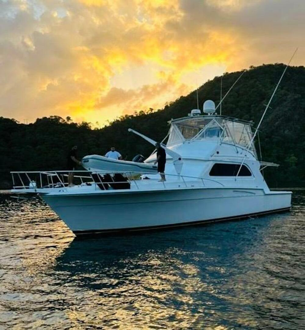 Bertram-54 1988 -Stuart-1988 Bertram 54 yacht at sunset on tranquil waters.-4947205