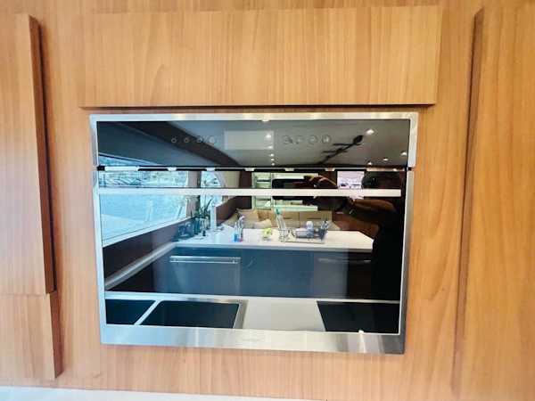 Bertram-54 1988 -Stuart-Modern kitchen interior on a 1988 Bertram 54 yacht with sleek appliances.-4947216