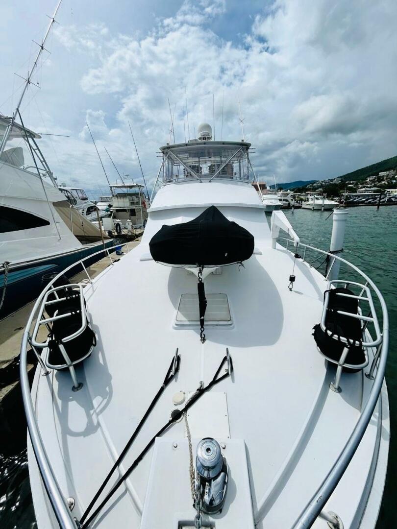 Bertram-54 1988 -Stuart-1988 Bertram 54 yacht docked at marina under cloudy sky.-4947236 | Thumbnail