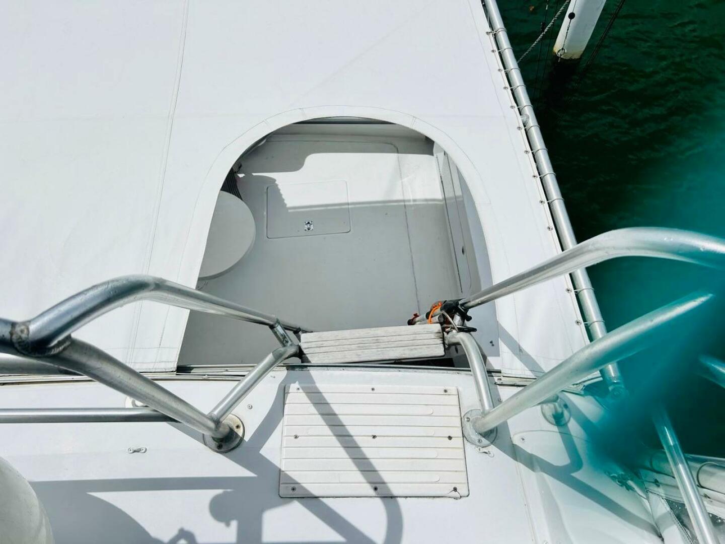 Bertram-54 1988 -Stuart-View of 1988 Bertram 54 yacht deck with metal railings and hatch.-4947208 | Thumbnail
