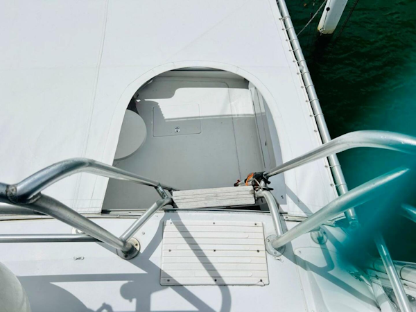 Bertram-54 1988 -Stuart-View of 1988 Bertram 54 yacht deck with metal railings and hatch.-4947208