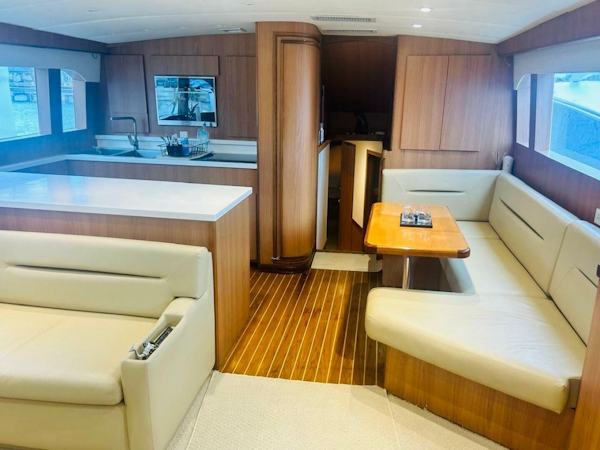 Bertram-54 1988 -Stuart-Luxurious interior of a 1988 Bertram 54 yacht with modern kitchen and seating area.-4947222