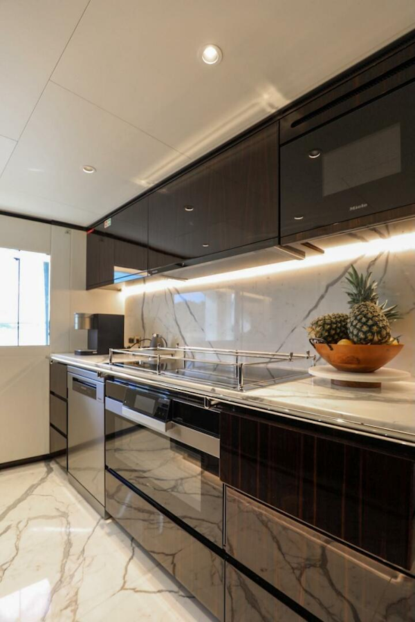Majesty Yachts-120 2025-Fractional Ownership Available Stuart-Florida-United States-Luxurious kitchen in 2025 Majesty 120 yacht with sleek cabinets and marble flooring.-4947543