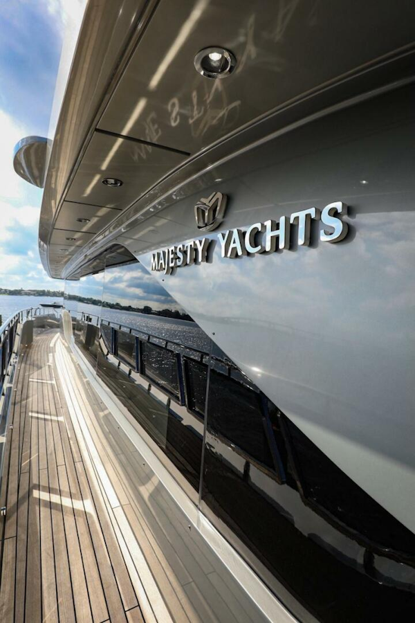 Majesty Yachts-120 2025-Fractional Ownership Available Stuart-Florida-United States-Majesty 120 yacht, 2025 model, sleek design with wooden deck and reflective hull.-4947519