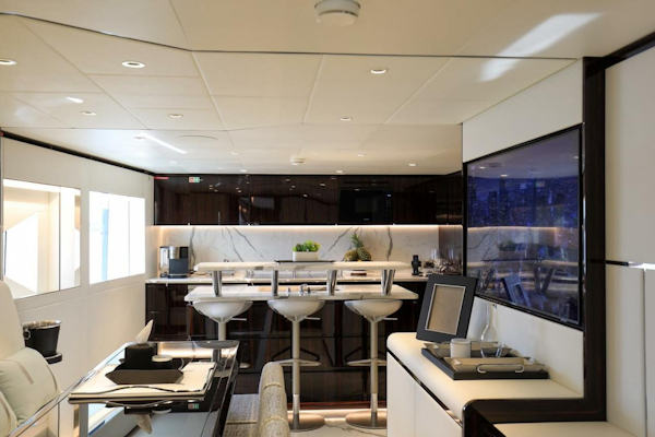 Majesty Yachts-120 2025-Fractional Ownership Available Stuart-Florida-United States-Luxurious interior of 2025 Majesty 120 yacht with modern bar and seating area.-4947538
