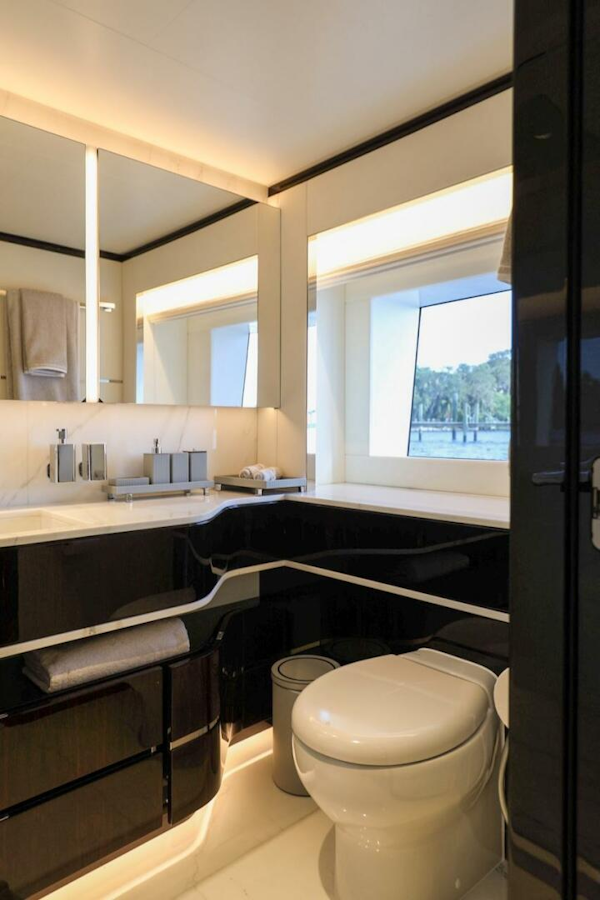 Majesty Yachts-120 2025-Fractional Ownership Available Stuart-Florida-United States-Luxurious bathroom in 2025 Majesty 120 yacht with modern fixtures and large window.-4947558