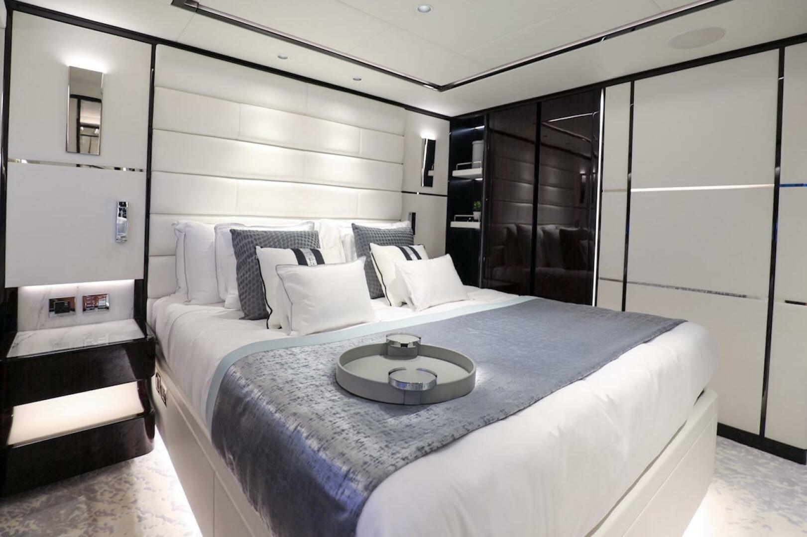Majesty Yachts-120 2025-Fractional Ownership Available Stuart-Florida-United States-Luxurious bedroom interior on 2025 Majesty 120 yacht, featuring elegant bedding and modern design.-4947550 | Thumbnail