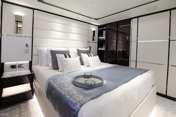 Majesty Yachts-120 2025-Fractional Ownership Available Stuart-Florida-United States-Luxurious bedroom interior on 2025 Majesty 120 yacht, featuring elegant bedding and modern design.-4947550
