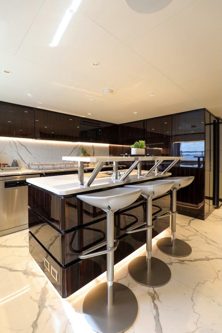 Majesty Yachts-120 2025-Fractional Ownership Available Stuart-Florida-United States-Luxurious 2025 Majesty 120 yacht kitchen with modern bar stools and sleek marble flooring.-4947541 | Thumbnail