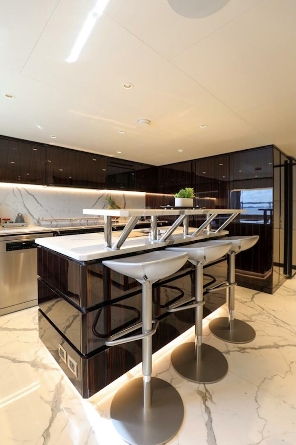 Majesty Yachts-120 2025-Fractional Ownership Available Stuart-Florida-United States-Luxurious 2025 Majesty 120 yacht kitchen with modern bar stools and sleek marble flooring.-4947541