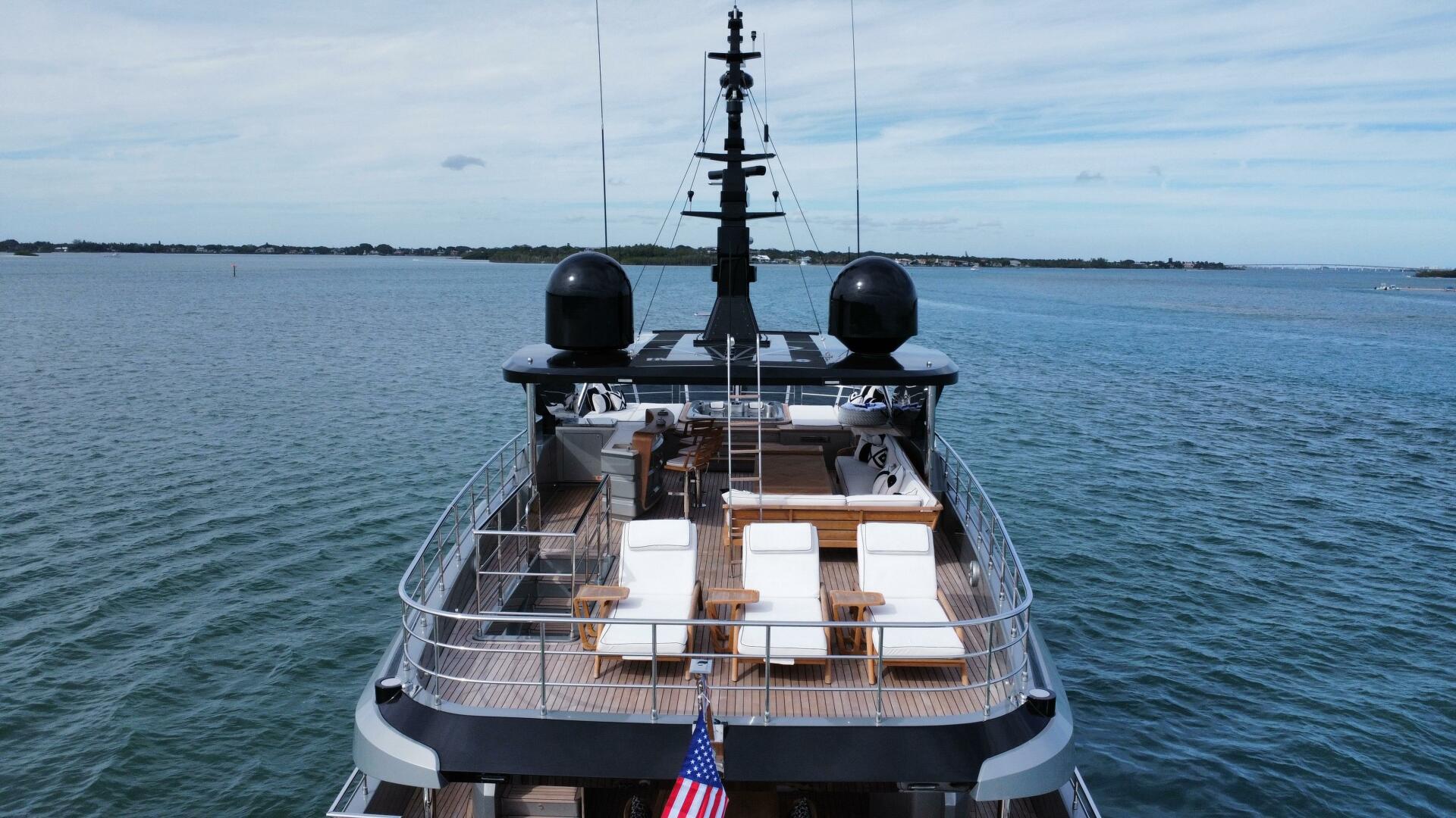 Majesty Yachts-120 2025-Fractional Ownership Available Stuart-Florida-United States-Majesty 120 yacht, 2025 model, cruising on open water with deck chairs and American flag.-5353500 | Thumbnail