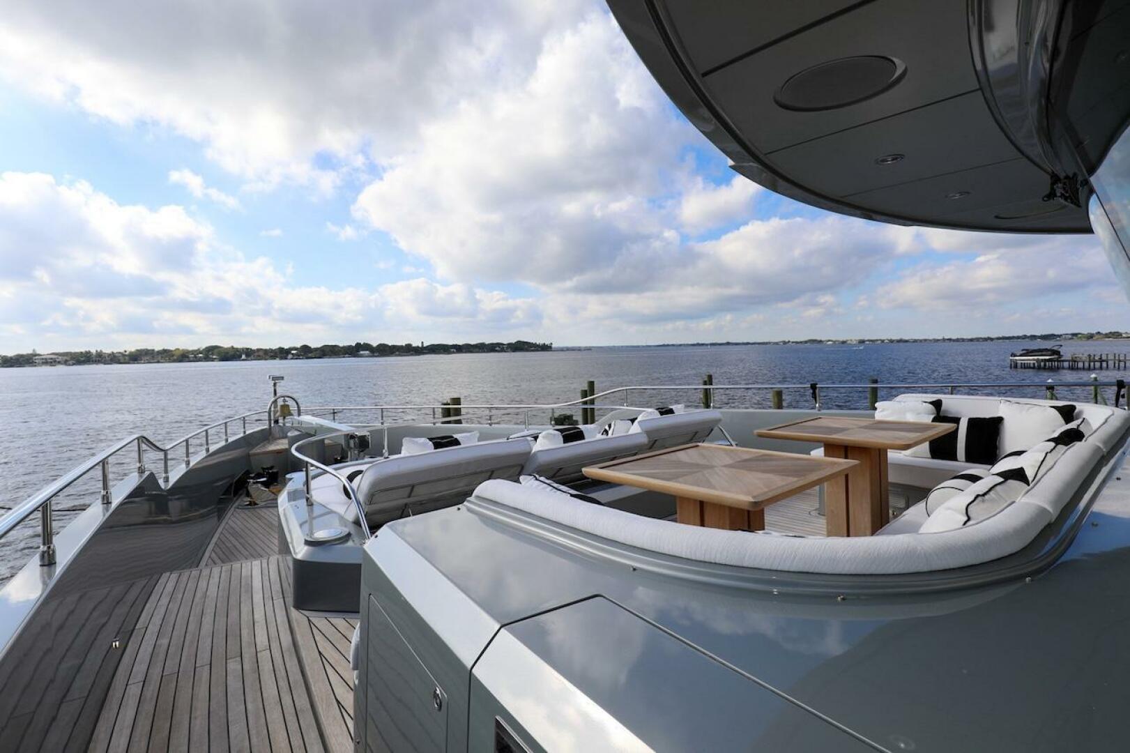 Majesty Yachts-120 2025-Fractional Ownership Available Stuart-Florida-United States-Luxurious 2025 Majesty 120 yacht deck with seating, overlooking serene waters and cloudy sky.-4947520 | Thumbnail
