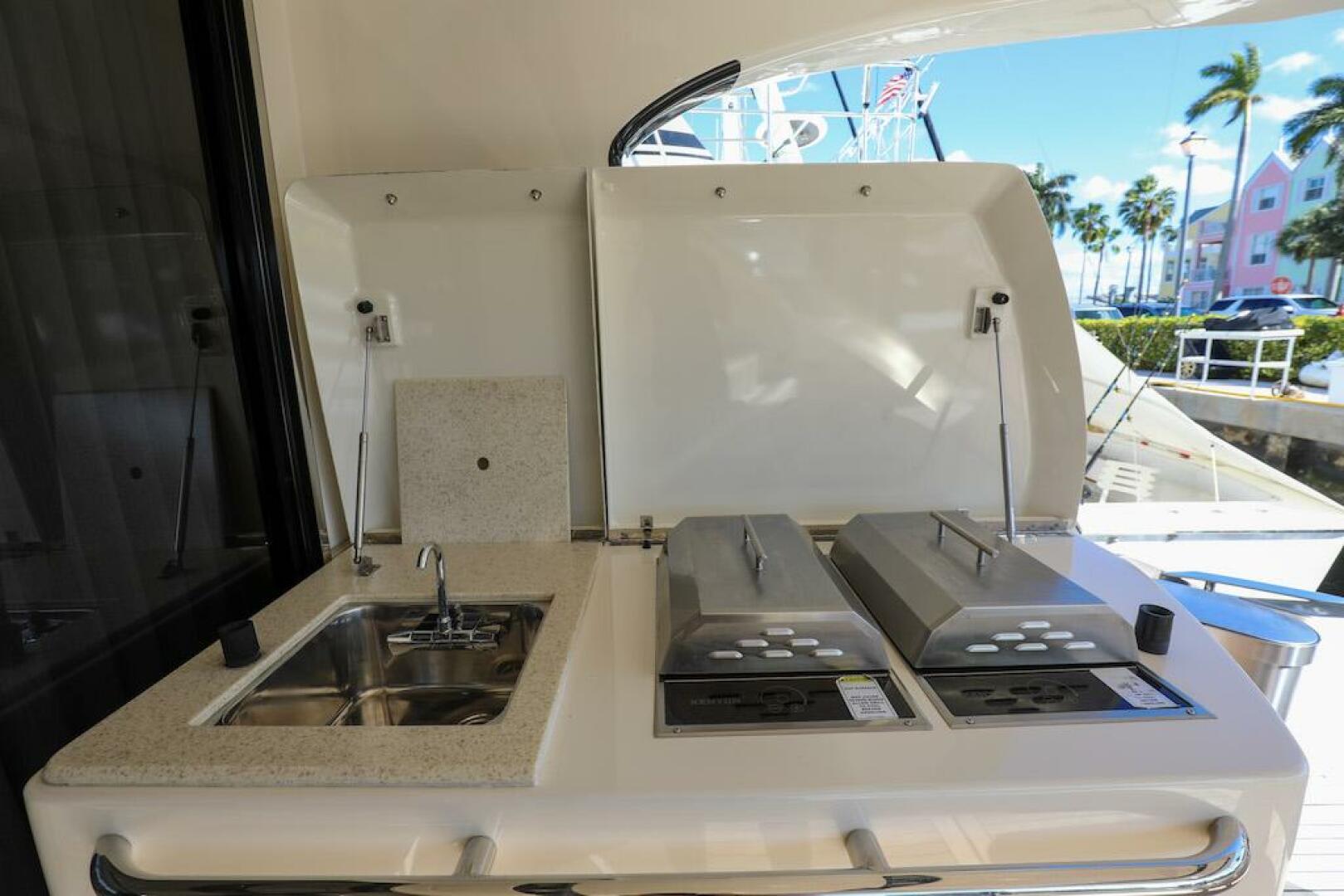 Marquis-660 Sport Yacht 2016 -Stuart-Outdoor kitchen on 2016 Marquis 660 Sport Yacht with sink and grill.-4947636 | Thumbnail