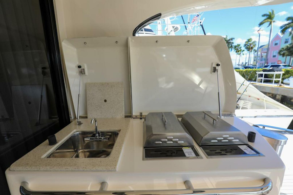 Marquis-660 Sport Yacht 2016 -Stuart-Outdoor kitchen on 2016 Marquis 660 Sport Yacht with sink and grill.-4947636
