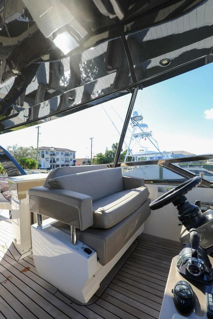 Marquis-660 Sport Yacht 2016 -Stuart-2016 Marquis 660 Sport Yacht helm with cushioned seating and modern controls.-4947630 | Thumbnail