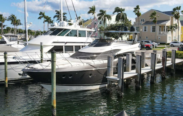 Marquis-660 Sport Yacht 2016 -Stuart-2016 Marquis 660 Sport Yacht docked at marina with palm trees.-4947605