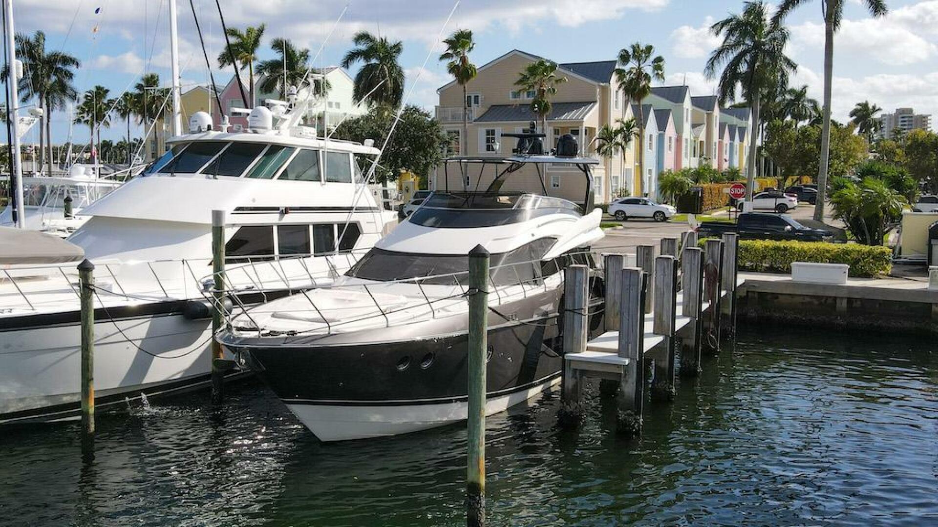 Marquis-660 Sport Yacht 2016 -Stuart-2016 Marquis 660 Sport Yacht docked in a sunny marina.-4947604 | Thumbnail