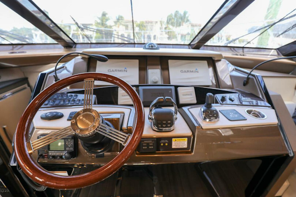 Marquis-660 Sport Yacht 2016 -Stuart-Cockpit of 2016 Marquis 660 Sport Yacht with Garmin navigation system and wooden steering wheel.-4947617