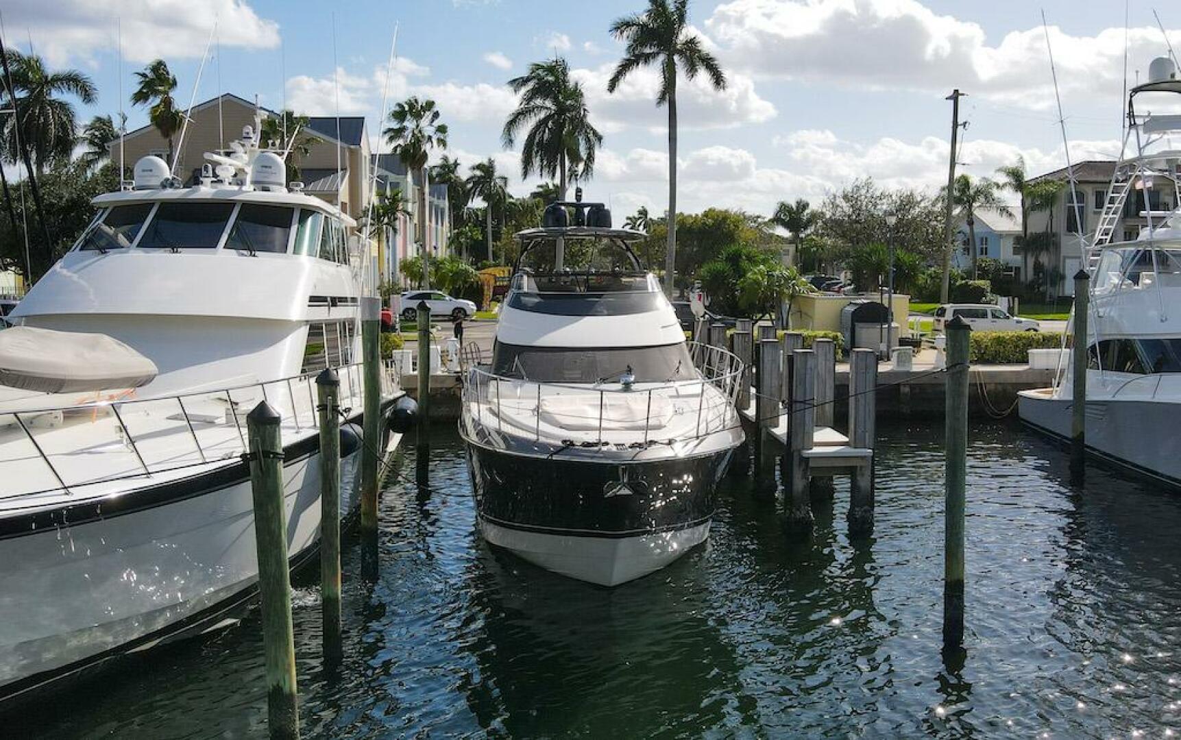 Marquis-660 Sport Yacht 2016 -Stuart-2016 Marquis 660 Sport Yacht docked in a marina with palm trees.-4947603 | Thumbnail
