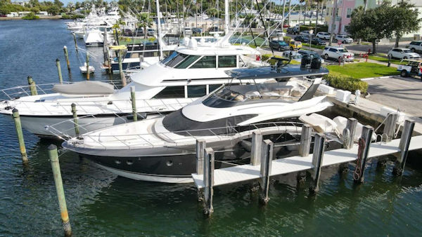 Marquis-660 Sport Yacht 2016 -Stuart-2016 Marquis 660 Sport Yacht docked at marina, surrounded by other boats.-4947607