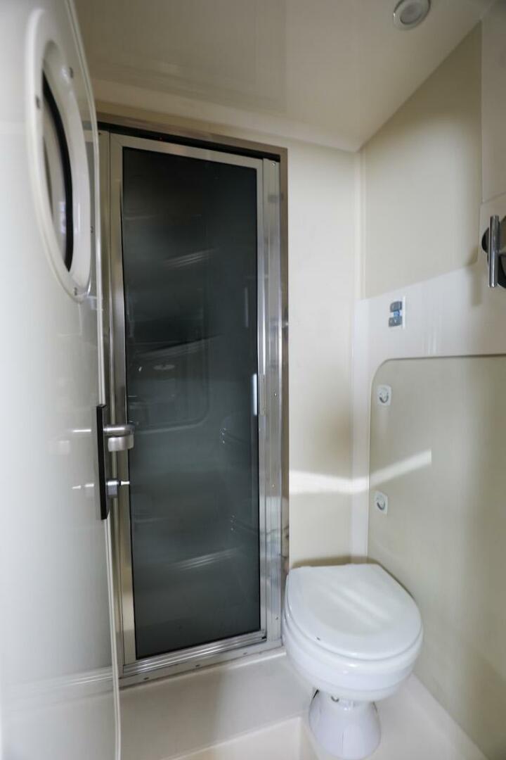 Marquis-660 Sport Yacht 2016 -Stuart-Bathroom interior of 2016 Marquis 660 Sport Yacht with shower and toilet.-4947649 | Thumbnail