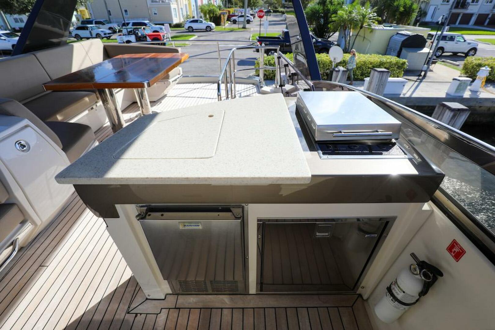Marquis-660 Sport Yacht 2016 -Stuart-Outdoor kitchen on 2016 Marquis 660 Sport Yacht with grill and seating area.-4947625 | Thumbnail