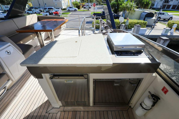 Marquis-660 Sport Yacht 2016 -Stuart-Outdoor kitchen on 2016 Marquis 660 Sport Yacht with grill and seating area.-4947625