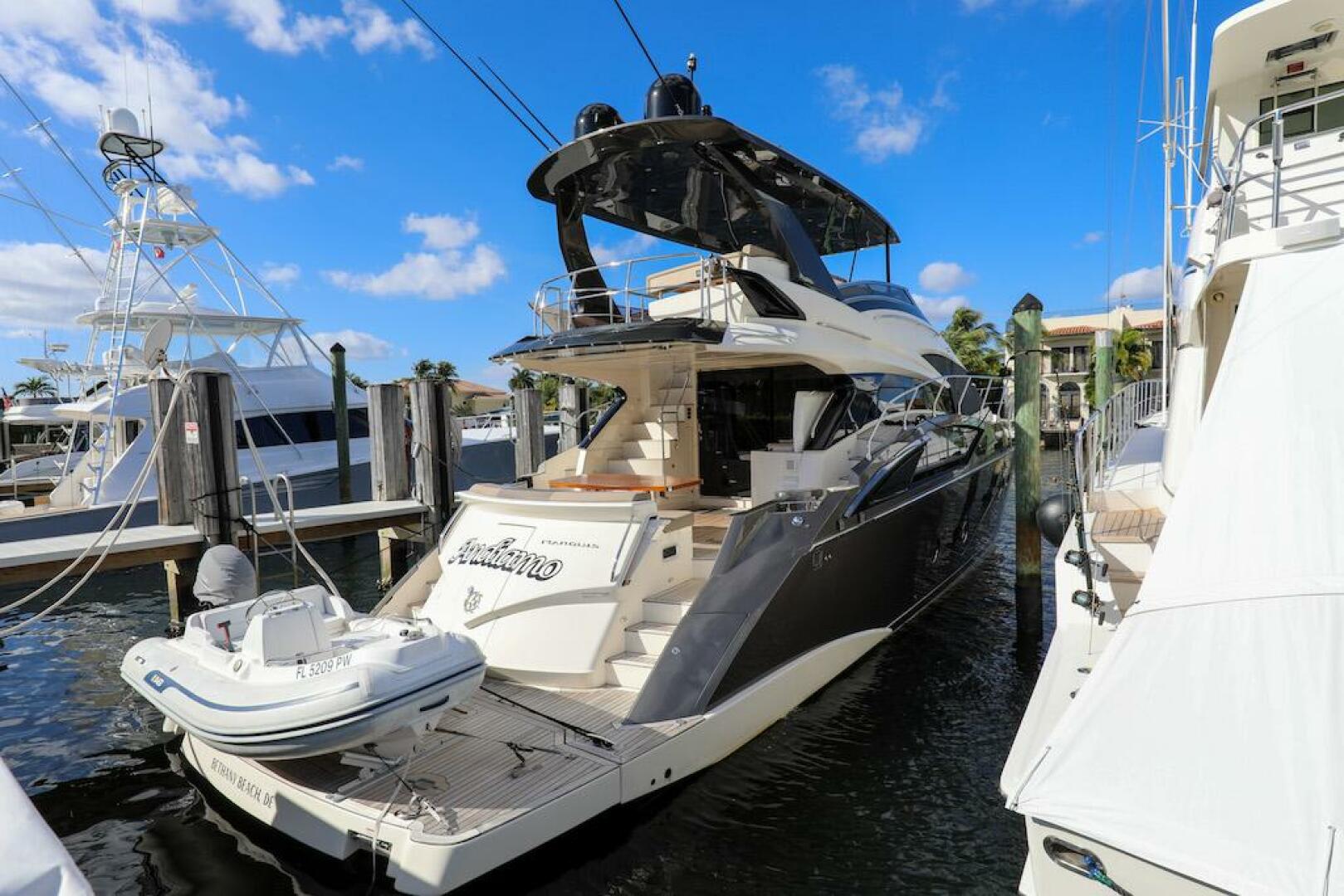 Marquis-660 Sport Yacht 2016 -Stuart-2016 Marquis 660 Sport Yacht docked at marina under clear blue sky.-4947643 | Thumbnail