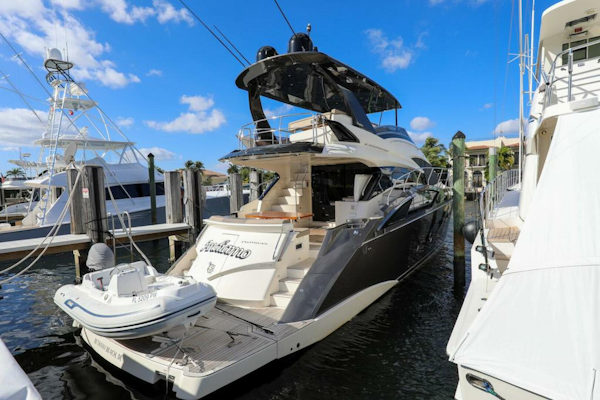 Marquis-660 Sport Yacht 2016 -Stuart-2016 Marquis 660 Sport Yacht docked at marina under clear blue sky.-4947643