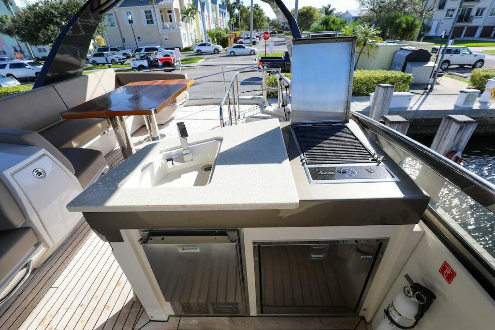 Marquis-660 Sport Yacht 2016 -Stuart-Outdoor kitchen on 2016 Marquis 660 Sport Yacht with sink and grill.-4947626 | Thumbnail