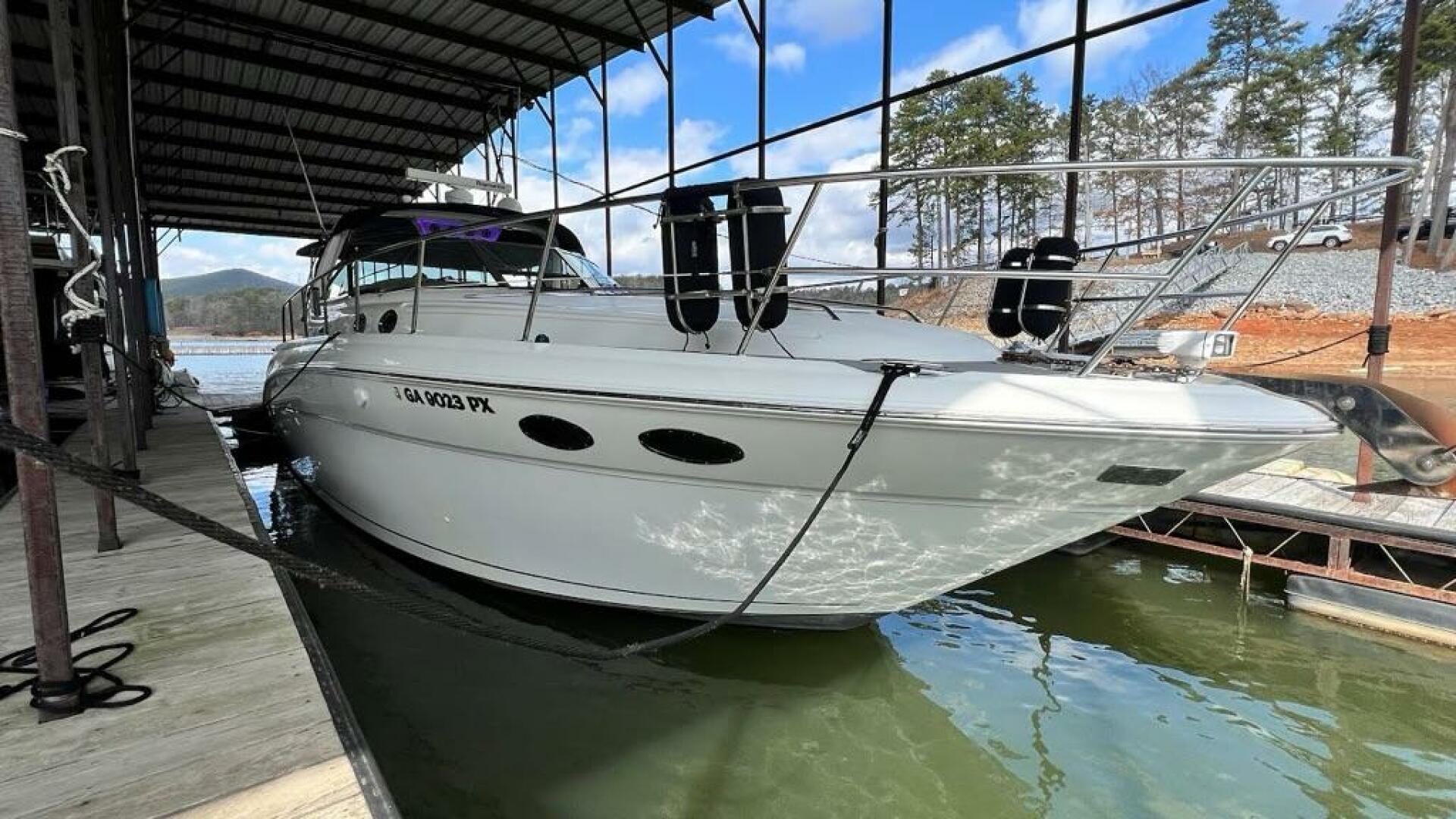Sea Ray-380 Sundancer 2003 -Stuart-2003 Sea Ray 380 Sundancer docked in a marina, surrounded by calm water and trees.-5185268 | Thumbnail