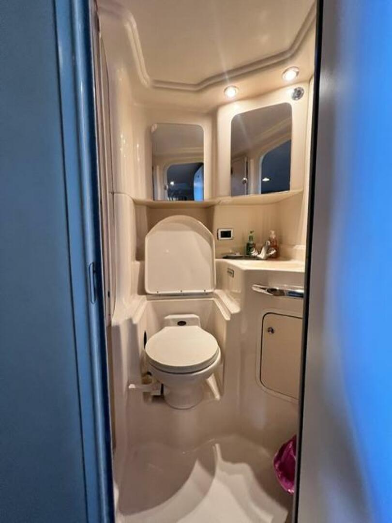 Sea Ray-380 Sundancer 2003 -Stuart-Bathroom interior of 2003 Sea Ray 380 Sundancer yacht, featuring toilet and vanity.-5185260 | Thumbnail
