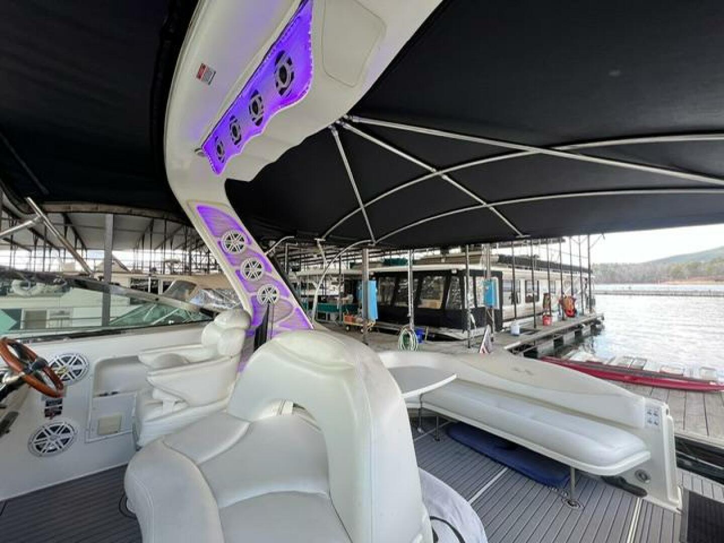 Sea Ray-380 Sundancer 2003 -Stuart-2003 Sea Ray 380 Sundancer yacht interior with seating and canopy at marina.-5185256 | Thumbnail