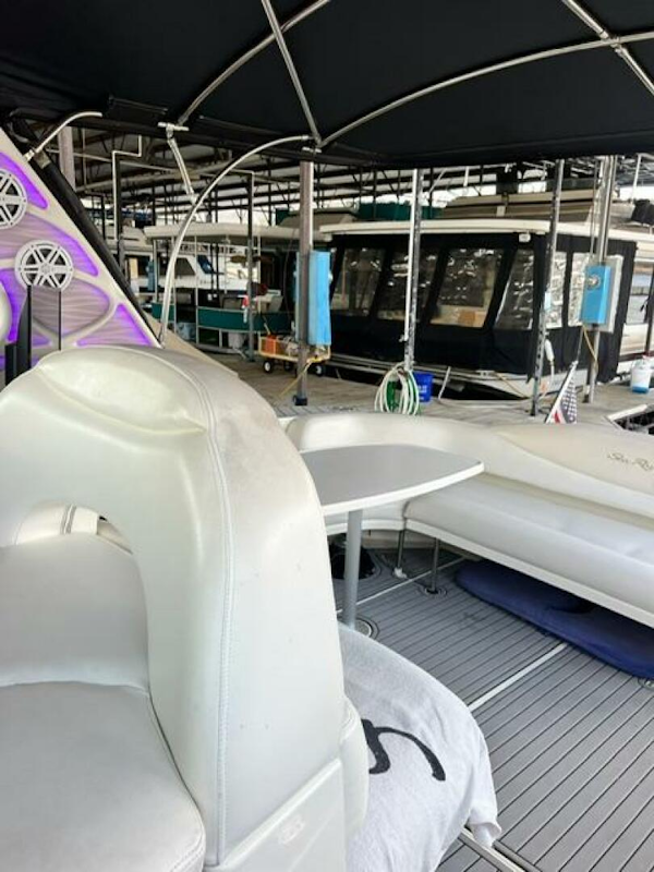 Sea Ray-380 Sundancer 2003 -Stuart-2003 Sea Ray 380 Sundancer interior with seating and table under canopy.-5185255