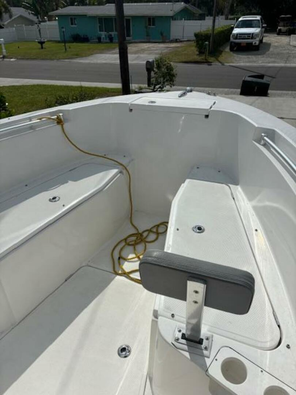 Release-208 RX 2016 -Stuart-2016 Release 208 RX boat interior with seating and rope, parked in a residential area.-5114925